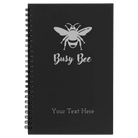 Small black spiral notebook laser etched with 'Busy Bee' design