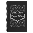 Small black spiral notebook laser etched with 'This Journal Belongs to' design