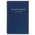 Small blue spiral notebook laser etched with 'Next Chapter' design