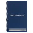 Small blue spiral notebook laser etched with 'The Story of Us' design